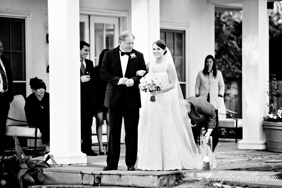 Bride standing with father