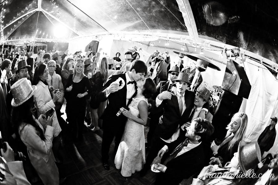 bride and groom kissing on dance floor