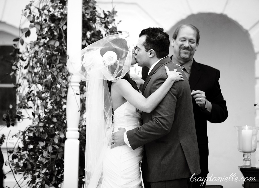 bride and groom first kiss