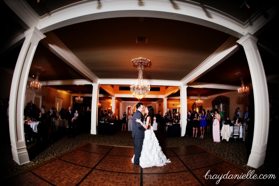 wide angle bride and groom dancing